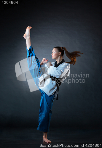 Image of The karate girl with black belt