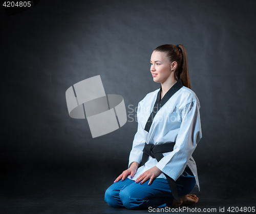 Image of The karate girl with black belt