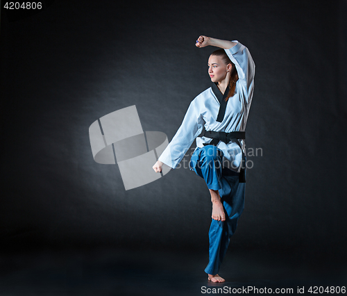 Image of The karate girl with black belt