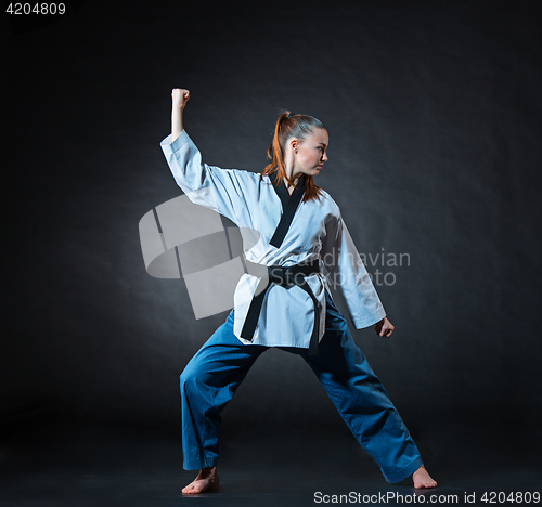 Image of The karate girl with black belt