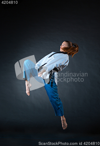 Image of The karate girl with black belt