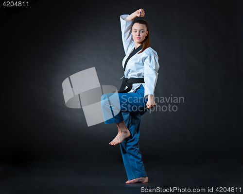 Image of The karate girl with black belt