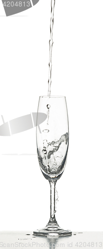 Image of The water splashing to glass on white background