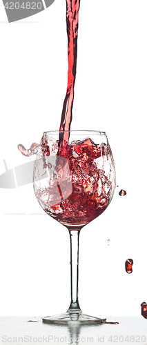 Image of Red wine splash over white background