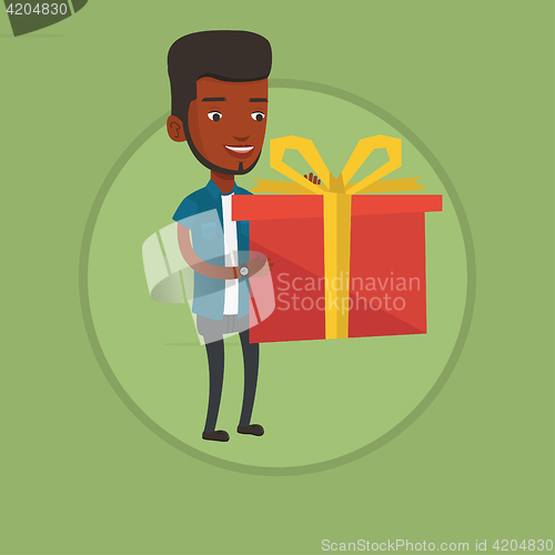 Image of Joyful man holding box with gift.