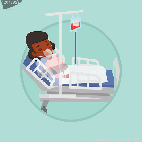 Image of Patient lying in hospital bed with oxygen mask.