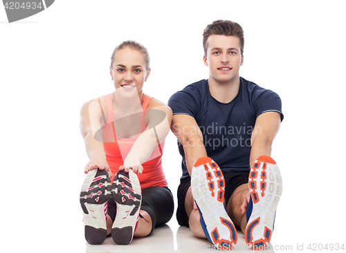 Image of happy sportive man and woman