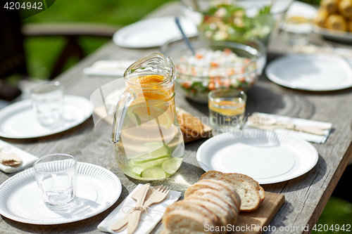 Image of table with food for dinner at summer garden party