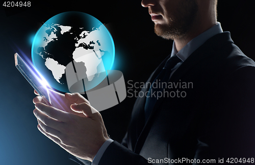 Image of close up of businessman with transparent tablet pc