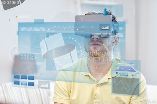 Image of young man in virtual reality headset or 3d glasses