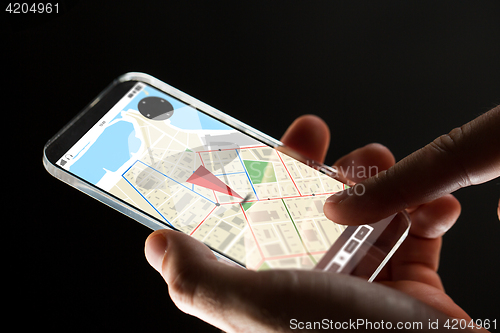 Image of close up of hand with gps map on smartphone