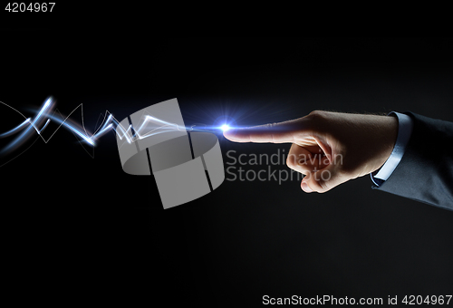 Image of businessman finger connecting to lightning