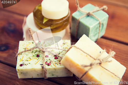 Image of close up of handmade soap bars on wood