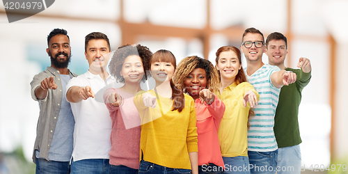 Image of international group of people pointing on you