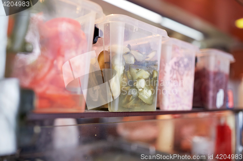 Image of containers with food at restaurant kitchen