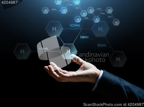 Image of close up of businessman hand with molecule