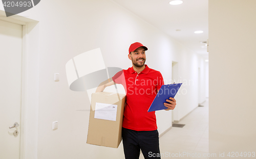 Image of delivery man with box and clipboard in corridor