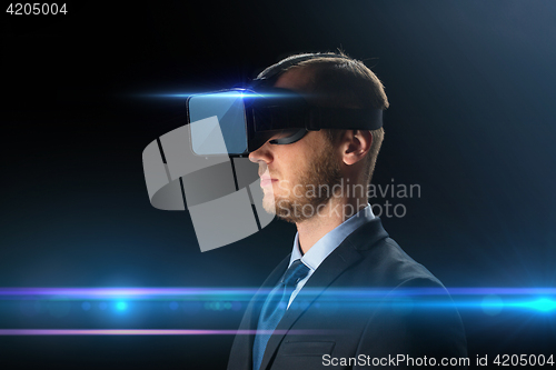 Image of businessman in virtual reality glasses or headset