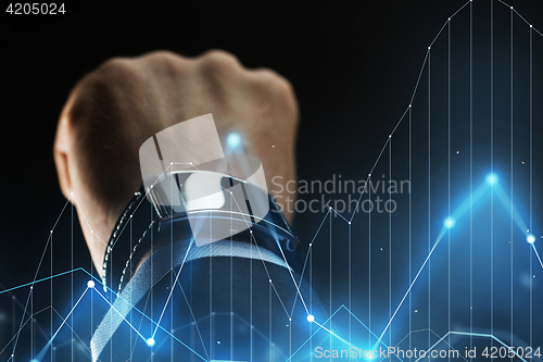 Image of close up of businessman hand with smartwatch