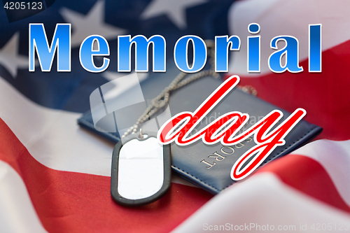 Image of memorial day words on american flag and dog tags