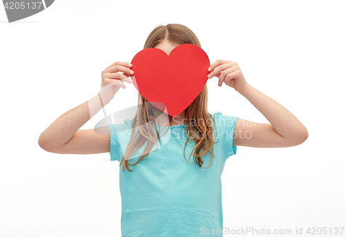 Image of little girl hiding her face behind red paper heart
