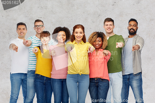 Image of international group of people pointing on you