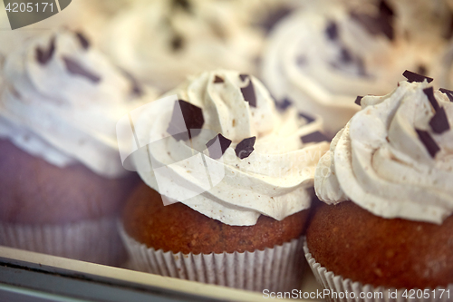 Image of close up of cupcakes or muffins with frosting