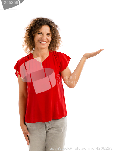 Image of Happy woman showing something