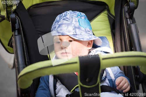 Image of baby boy sitting in the pram