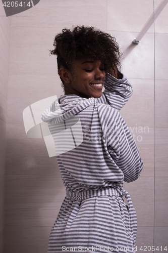 Image of beautiful black woman wearing  bathrobe