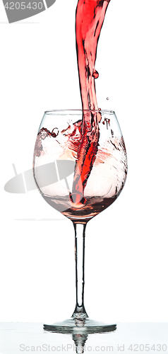 Image of Red wine splash over white background