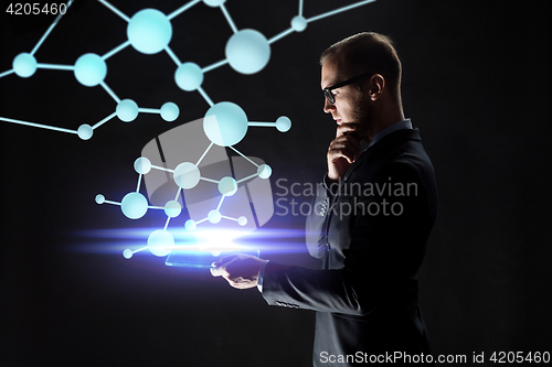 Image of close up of businessman with transparent tablet pc