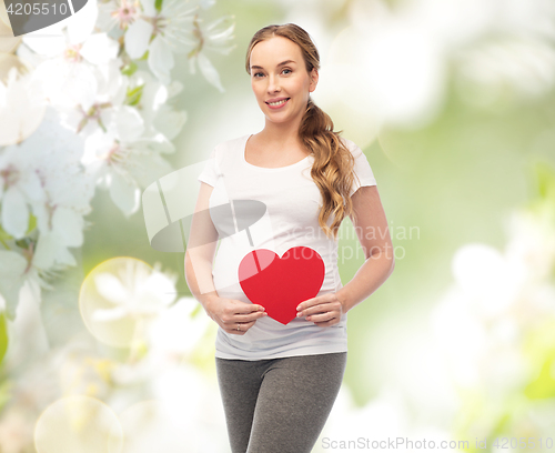 Image of happy pregnant woman with red heart