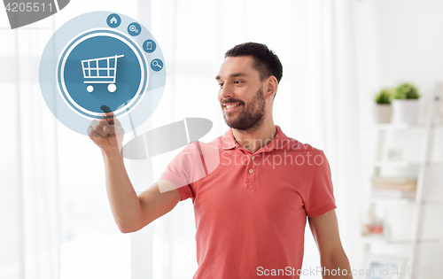 Image of man with shopping cart icon projection at home