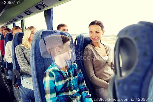 Image of happy family riding in travel bus