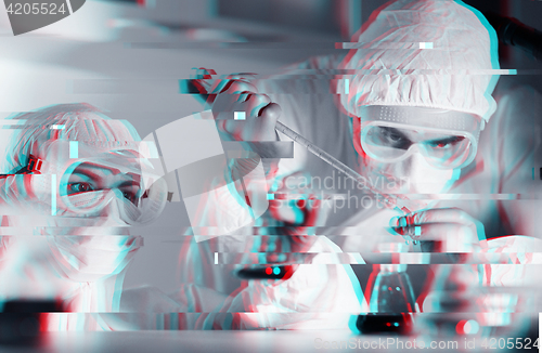 Image of close up of scientists making test in lab