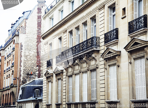 Image of houses on french streets of Paris. citylife concept, black balcony lace