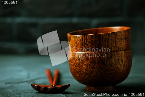 Image of wood bowl with wooden chopsticks