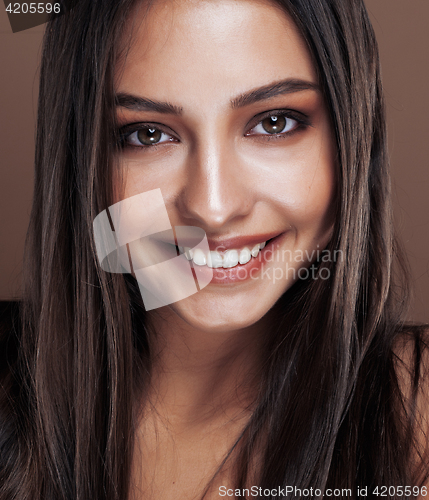 Image of cute happy young indian real woman in studio close up smiling, fashion mulatto