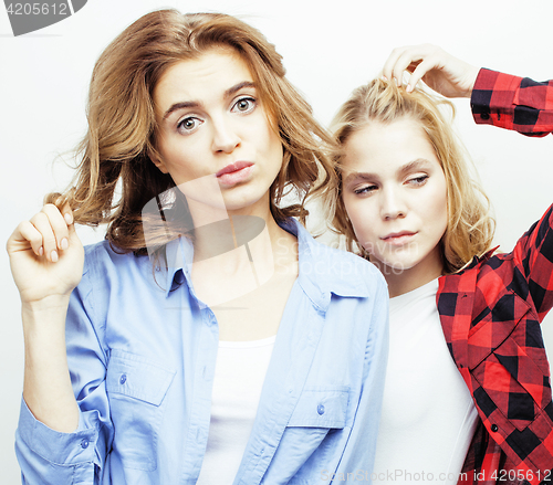 Image of best friends teenage girls together having fun, posing emotional on white background, besties happy smiling, lifestyle people concept close up
