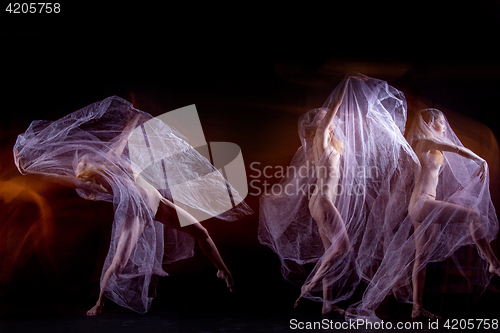 Image of The sensual and emotional dance of beautiful ballerina