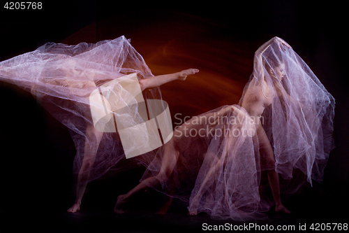 Image of The sensual and emotional dance of beautiful ballerina