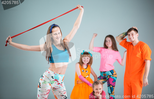 Image of Group of man, woman and teens dancing hip hop choreography