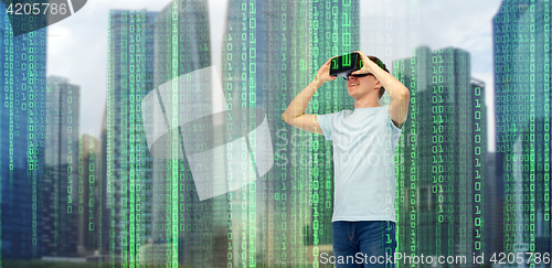 Image of happy man in virtual reality headset or 3d glasses