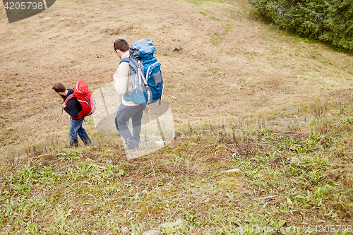 Image of friends with backpacks hiking