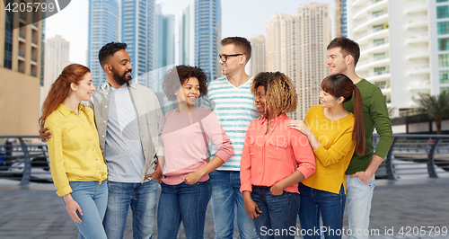 Image of international group of people talking in city