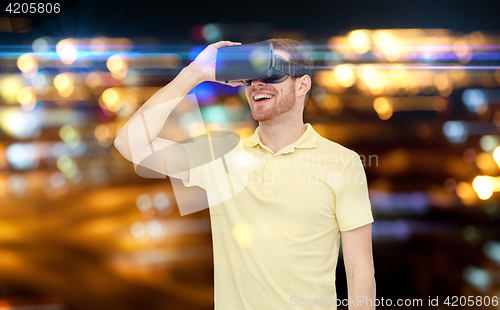 Image of happy man in virtual reality headset or 3d glasses