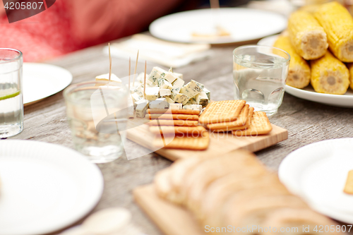 Image of table with food for dinner at summer garden party