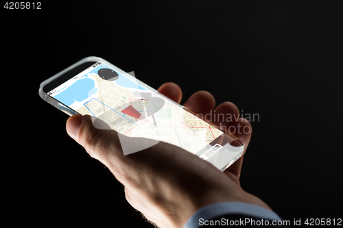 Image of close up of hand with gps map on smartphone