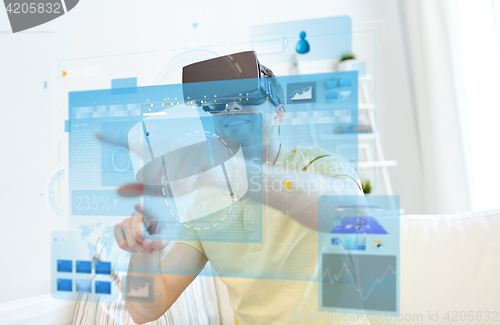 Image of young man in virtual reality headset or 3d glasses